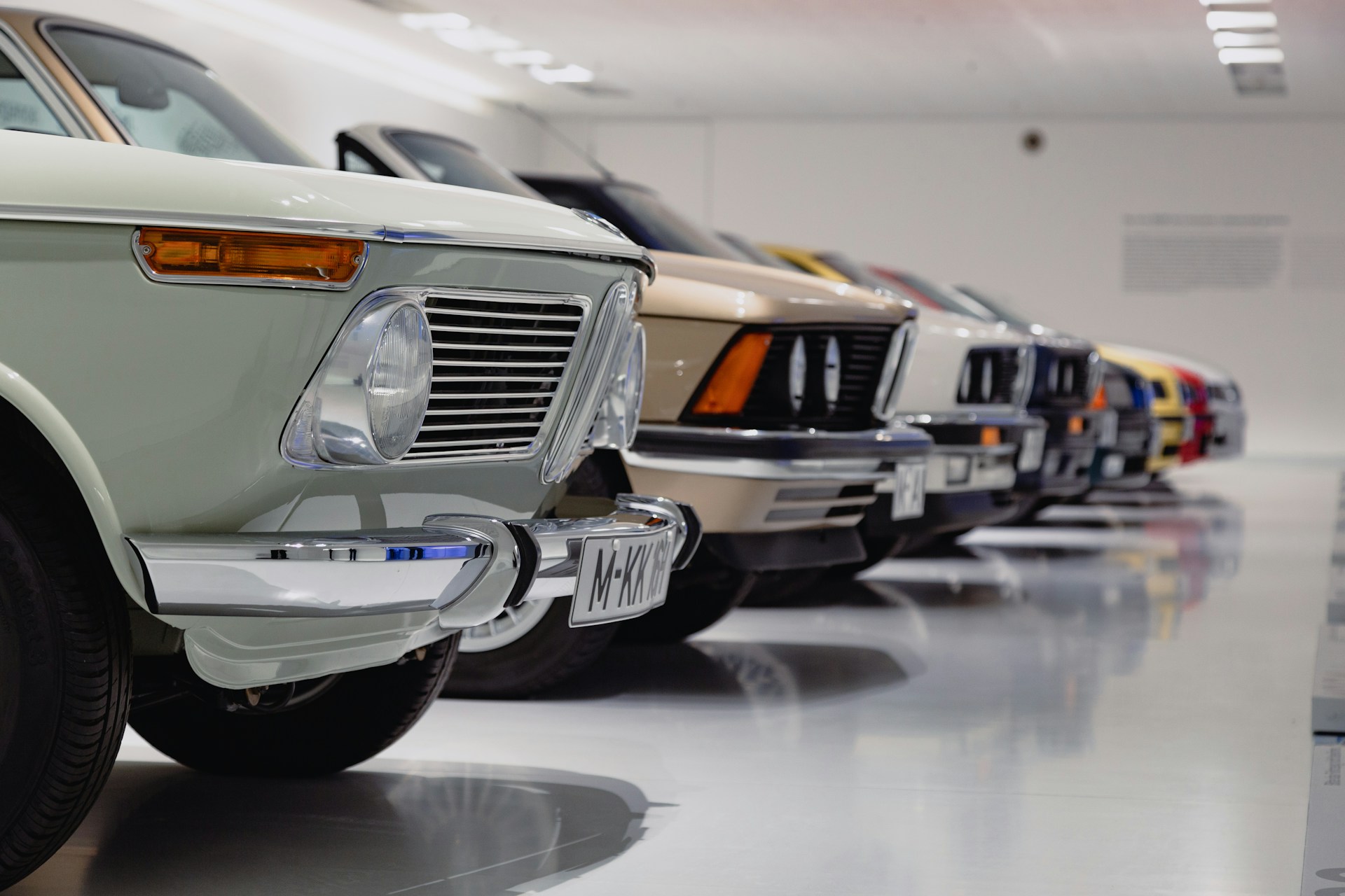A row of cars in a showroom