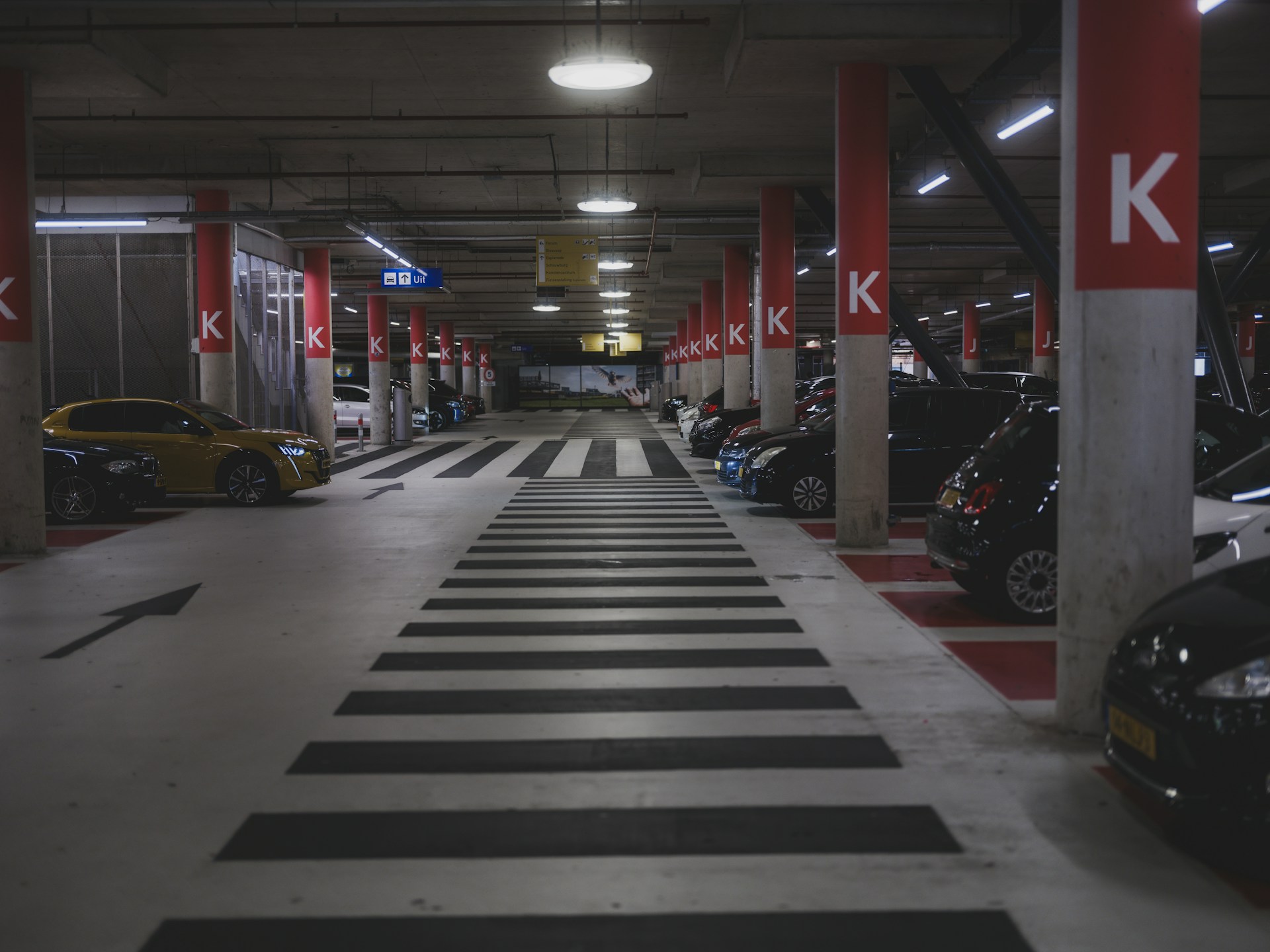 cars parked in dimly lit underground car park