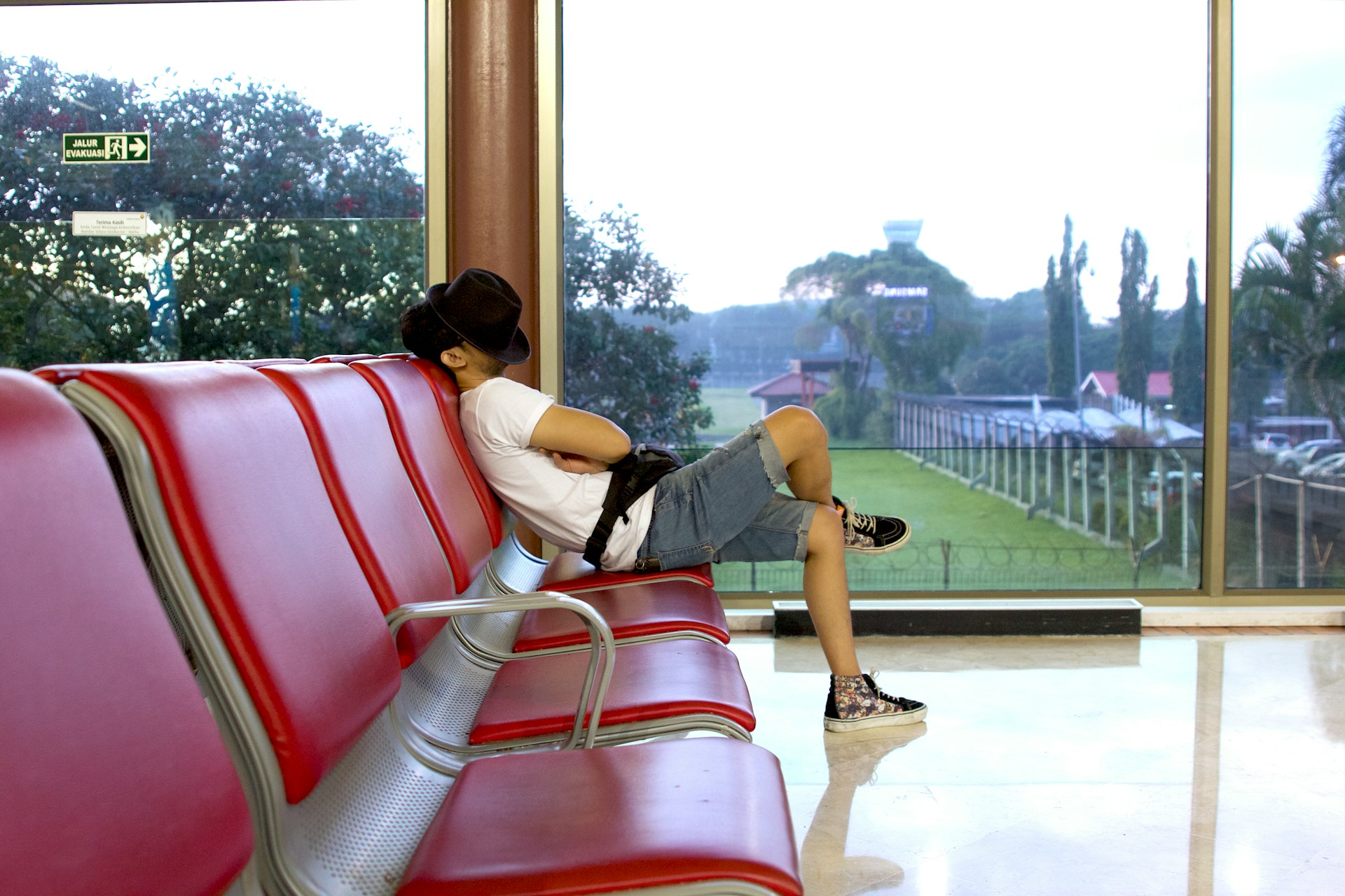 A man sleeping in an airport terminal