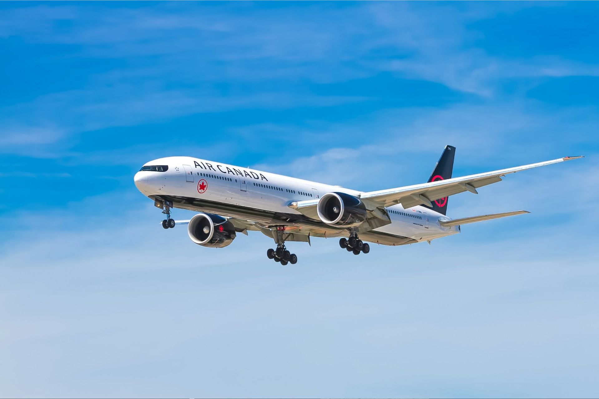 A plane flying through a clear sky