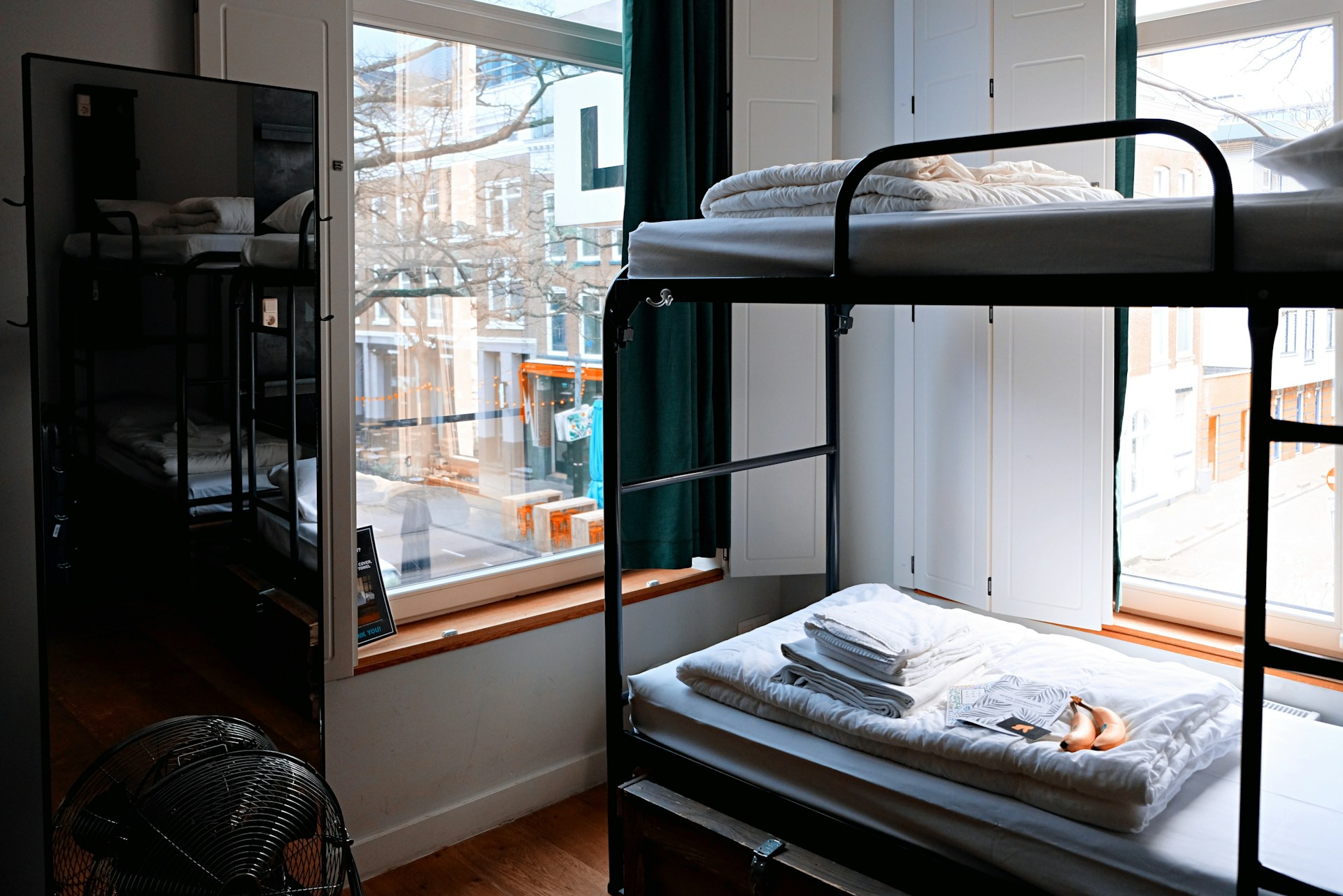 Bunk beds by the window in a hostel