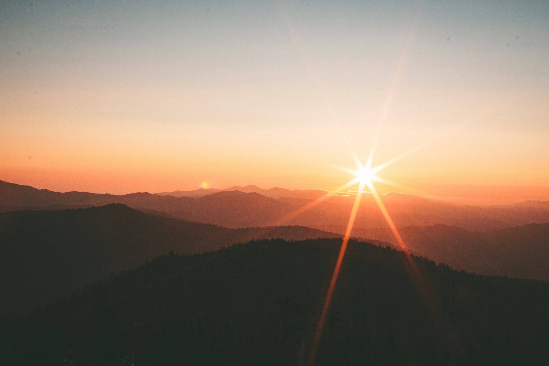 Sunset over rolling hills
