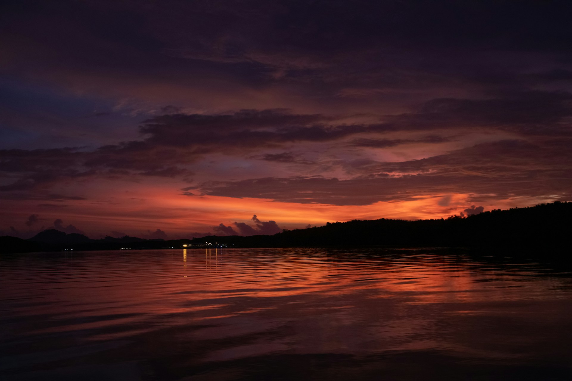 sunset over body of water