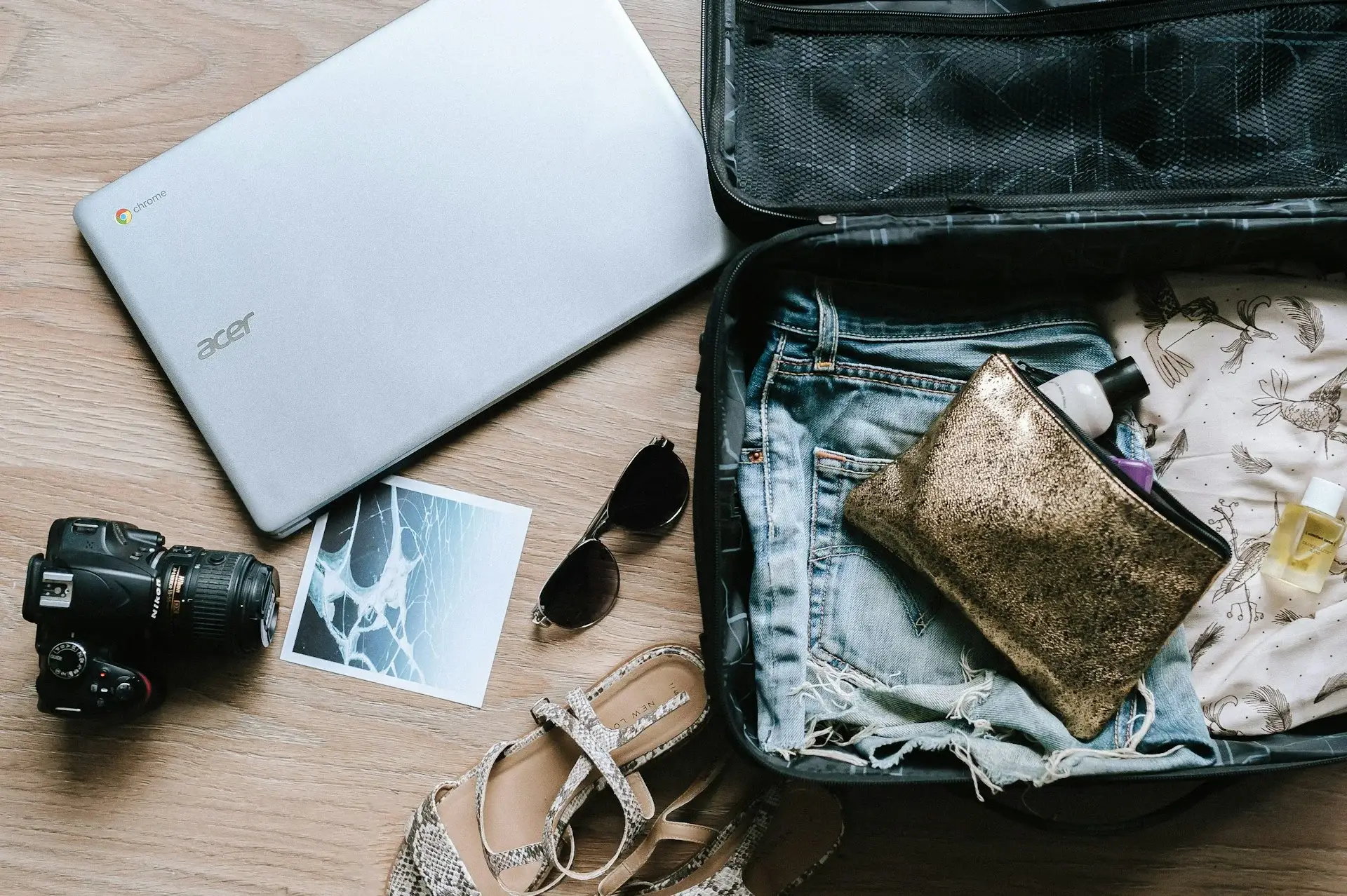 A half-packed suitcase laying open on the floor